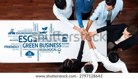 A team engages in collaboration around a table, focusing on green business strategies with key emphasis on ESG principles, promoting sustainability and ethical investment practices. Amity