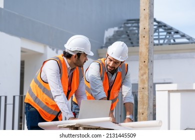 Team Engineer And Architects Are Meeting To Plan For New Project Measuring Layout Of Building Blueprints In Construction Site,Construction Residential New House In Progress At Building Site.