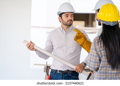 Team Engineer And Architects Are Meeting To Plan For New Project Measuring Layout Of Building Blueprints In Construction Site,Construction Residential New House In Progress At Building Site.