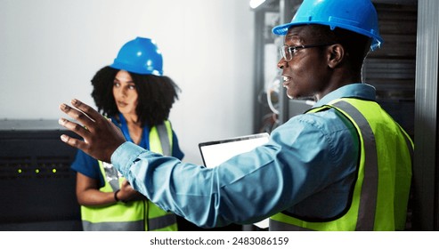 Team, engineer and hardware maintenance in server room for system inspection, update or network on computer. Data center, people or technician planning cybersecurity upgrade or information technology