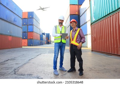 team engineer he is working in container box yard area of  logistics transportation import export or shipping industry 
