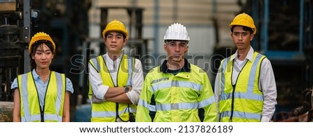 Team engineering, worker standing at warehouse auto parts. industry factory car automobile. Teamwork technician work successful, connection partnership successful concept.