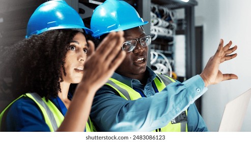 Team, engineers and communication in server room for support, repairs and equipment by laptop. Man, woman and together with PPE for cybersecurity, collaboration and brainstorming in data center - Powered by Shutterstock