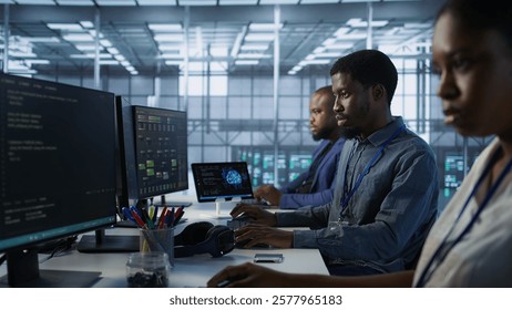Team of engineers in data center developing and maintaining disaster recovery plans ensuring minimal downtime. Server room workers using data analytics to monitor performance, camera A