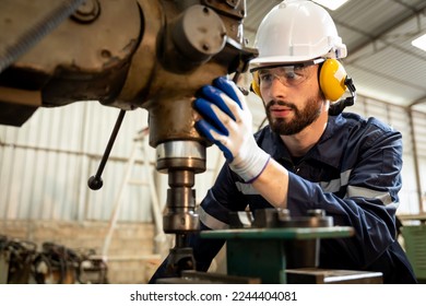 Team of engineers practicing maintenance Taking care and practicing maintenance of old machines in the factory so that they can be used continuously. - Powered by Shutterstock