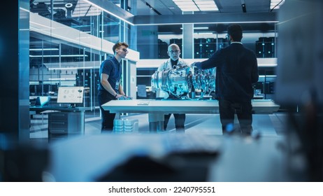 Team of Engineers, Senior Project Manager and Machinery Operators Collaborate on a New Type of a Turbine Engine, Standing with Tablet and Laptop Computers in Scientific Technology Lab. - Powered by Shutterstock