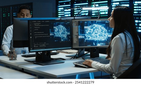 Team of engineers using AI tech on computer to do checkup in server room. Data center workers using artificial intelligence technology to process datasets for training, camera A