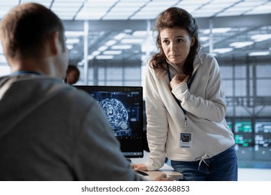 Team of engineers using machine learning to optimize data center operations, improving efficiency of infrastructure. Coworkers doing brainstorming, implementing server virtualization