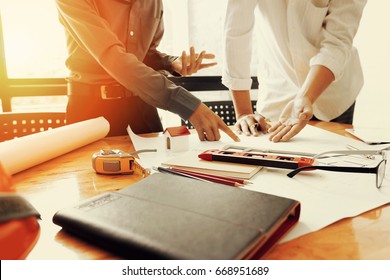 Team of engineers working together in a architect office. - Shutterstock ID 668951689