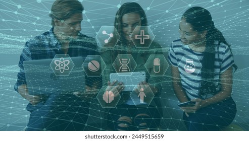 A team of executives is using electronic devices in an office. A digital representation of a global computer network. The image shows medical icons and connections between them on a blue background. 