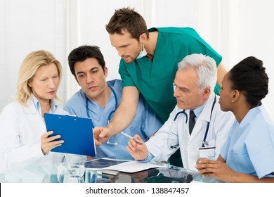 Team Of Experts Doctors Examining Medical Exams
