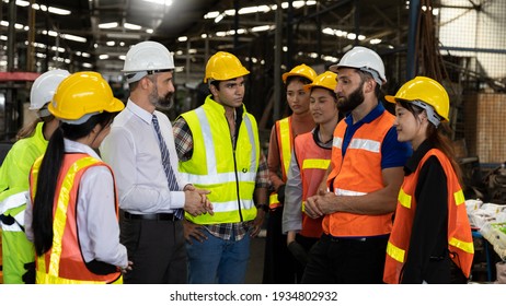 Team Of Factory Workers Or Technicians Celebrate The Success Together. Collective Appreciation And Team Effort In A Factory. Leadership In Teamwork