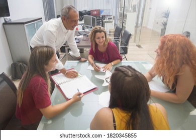 Team Of Five People Conducting A Business Meeting. Young People On A Working Day In A Farm Administration Office In Spain