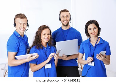 Team Of Friendly Technical Support Dispatchers In Office