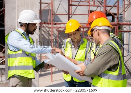 Team group of contractor and architect with foreman explaining about scheme building site for planning project to worker and looking blueprint, construction site, development and structure.