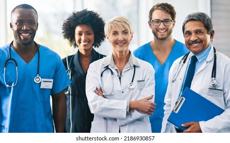 Team Or Group Of A Doctor, Nurse And Medical Professional Colleagues Or Coworkers Standing In A Hospital Together. Portrait Of Diverse Healthcare Workers Looking Confident And Happy About Medicine