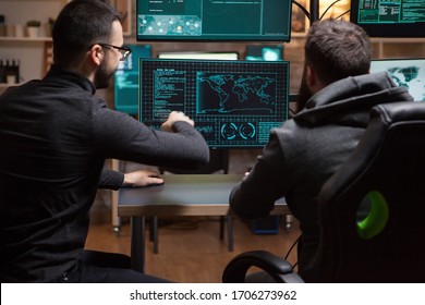 Team of hackers planning a cyber attack using a dangerous malware. - Shutterstock ID 1706273962