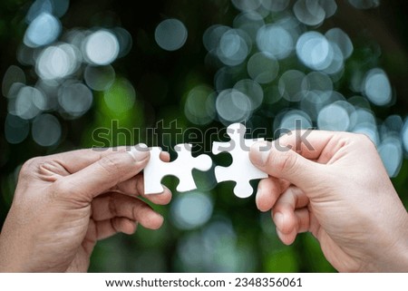 team hand power full hand placing the jigsaw puzzle piece for conect business partner and connection start up new project concept worker unity team.