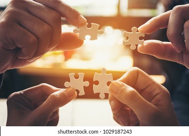 team hand power full  hand trust and placing the  jigsaw puzzle piece for connect business partner and connection start up new project concept worker  unity team, Team Digital Nomad join partner - Shutterstock ID 1029187243