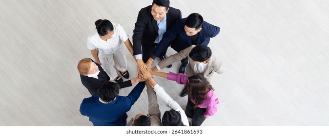 team hands together. Unity and teamwork. High angle top view business team showing unity with their hands together
