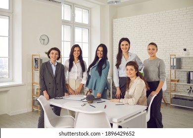 Team Of Happy Successful Young Business Women In Their 20s And 30s Smiling At Camera. Group Portrait Of Female Company Employees Or Business Partners Gathered Together In Office For Work Meeting