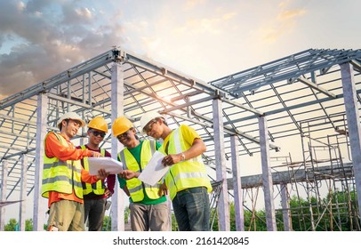 A Team Of Home Builders Looking Structure On Blueprint  Meeting To Plan The Next Level Of Construction Work. Engineer Or Foreman With Team Construction Work On The Construction Site