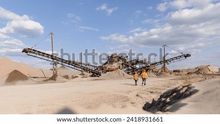 Team of industrial workers inspect sand quarry and check Industry machine for stone crusher, belt conveyor. Banner open pit mine factory.