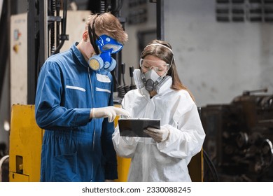 Team inspector wearing chemical protective mask and hazmat suit examining chemistry in industrial. Analysing harmful substances to human body and environment. research working  - Powered by Shutterstock