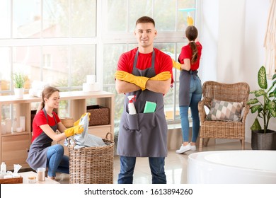 Team Of Janitors Cleaning Bathroom