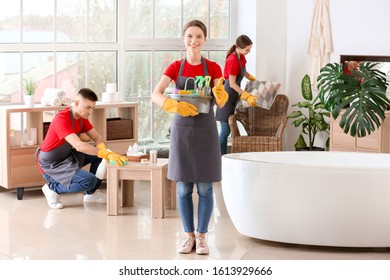 Team Of Janitors Cleaning Bathroom