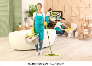 Team Of Janitors Cleaning Bathroom