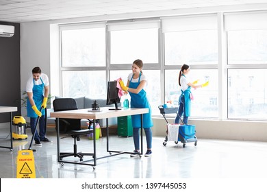 Team Of Janitors Cleaning Office