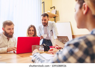 Team job. Photo young and mature businessmans working with new startup project in modern office or loft. Generic design notebook on wood table. Teamwork, business, creative meeting, cooperation - Shutterstock ID 1091088926
