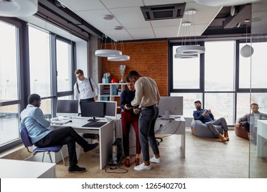 Team job succes . Multiethnic young active managers working with new startup project in modern office. Team anf Togetherness concept. - Powered by Shutterstock