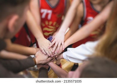 Team Of Kids Children Basketball Players Stacking Hands In The Court, Sports Team Together Holding Hands Getting Ready For The Game, Playing Indoor Basketball, Team Talk With Coach, Close Up Of Hands