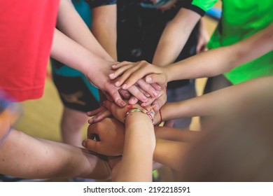 Team Of Kids Children Basketball Players Stacking Hands In The Court, Sports Team Together Holding Hands Getting Ready For The Game, Playing Indoor Basketball, Team Talk With Coach, Close Up Of Hands