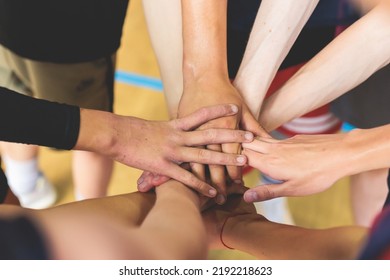 Team Of Kids Children Basketball Players Stacking Hands In The Court, Sports Team Together Holding Hands Getting Ready For The Game, Playing Indoor Basketball, Team Talk With Coach, Close Up Of Hands