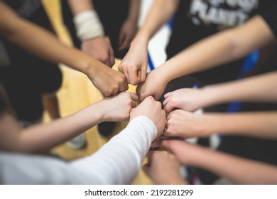 Team Of Kids Children Basketball Players Stacking Hands In The Court, Sports Team Together Holding Hands Getting Ready For The Game, Playing Indoor Basketball, Team Talk With Coach, Close Up Of Hands