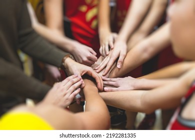 Team Of Kids Children Basketball Players Stacking Hands In The Court, Sports Team Together Holding Hands Getting Ready For The Game, Playing Indoor Basketball, Team Talk With Coach, Close Up Of Hands