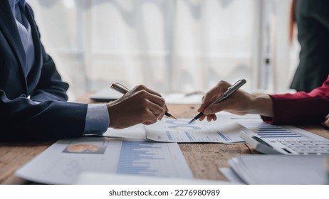Team of lawyers and tax auditors brainstorming together and calculating the balance sheet and historical financial accounts of the company and shareholders. to detect mistakes and prevent bribery