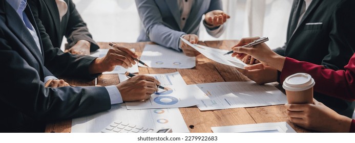 Team of lawyers and tax auditors brainstorming together and calculating the balance sheet and historical financial accounts of the company and shareholders. to detect mistakes and prevent bribery