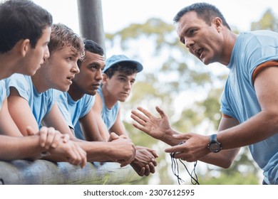 Team leader motivating team at boot camp obstacle course - Powered by Shutterstock