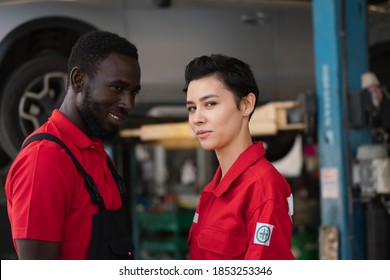 Team Maintenance Technician Female The Car Is Inspecting And Working On The Engine. Engineer, Professional Technician, Automobile Manufacturing Industry, Quality Standards, Consumer Market