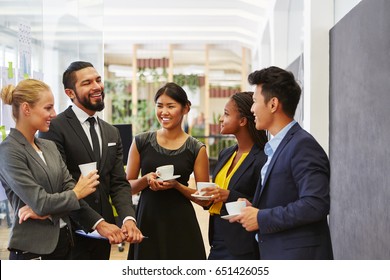 Team Making Small Talk In Their Coffee Break