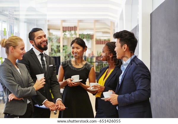 Team making small
talk in their coffee break