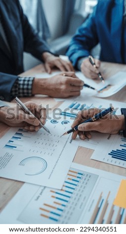 Team of male bookkeepers people working with balance sheet to analyze problems and find solutions to develop business organization and company's stock market system. Common stock and preferred stock
