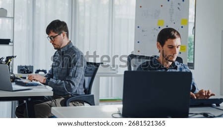 Team of male developers work code control robotics system and software automation project write prompt AI data bot at office. Artificial intelligence, collaboration, robotic, debugging, machine learn.