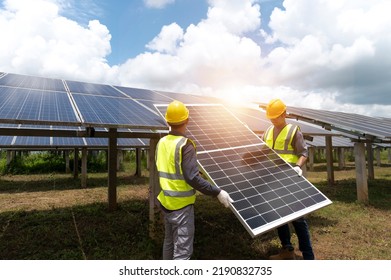 A team of male engineers is about to install solar panels. at the solar power station Engineer team ordered and installed solar cells. - Shutterstock ID 2190832735
