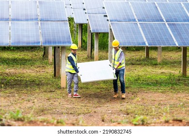 A Team Of Male Engineers Is About To Install Solar Panels. At The Solar Power Station Engineer Team Ordered And Installed Solar Cells.