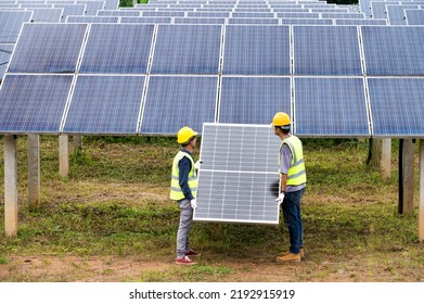 A Team Of Male Engineers Is About To Install Solar Panels. At The Solar Power Station Engineer Team Ordered And Installed Solar Cells.